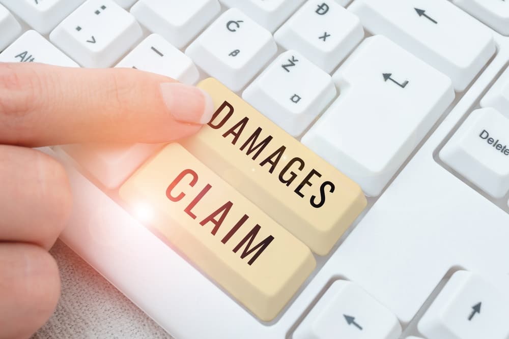 Text caption presenting "Damages Claim": Business showcase Demand Compensation Litigate Insurance File Suit.