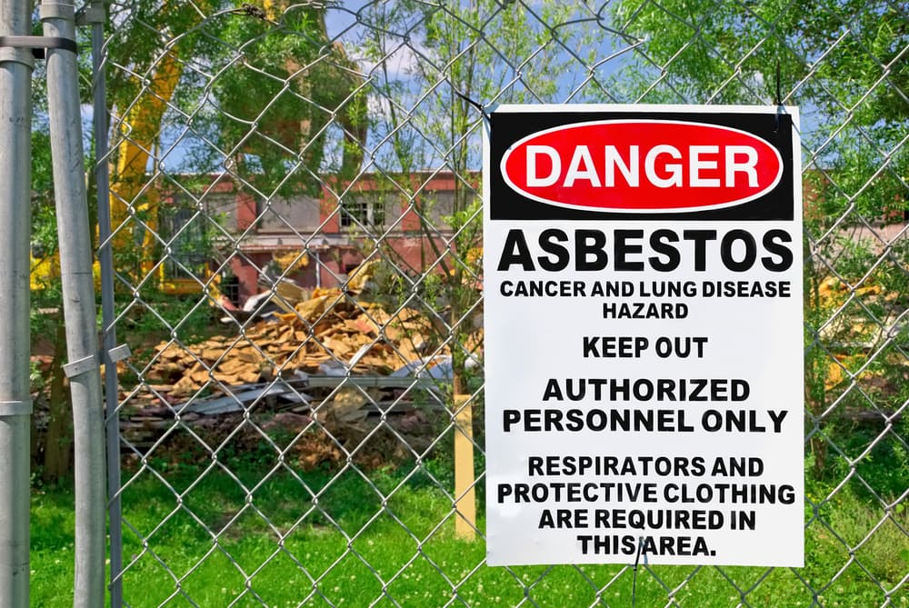 Danger Sign Asbestos Posted on Fence