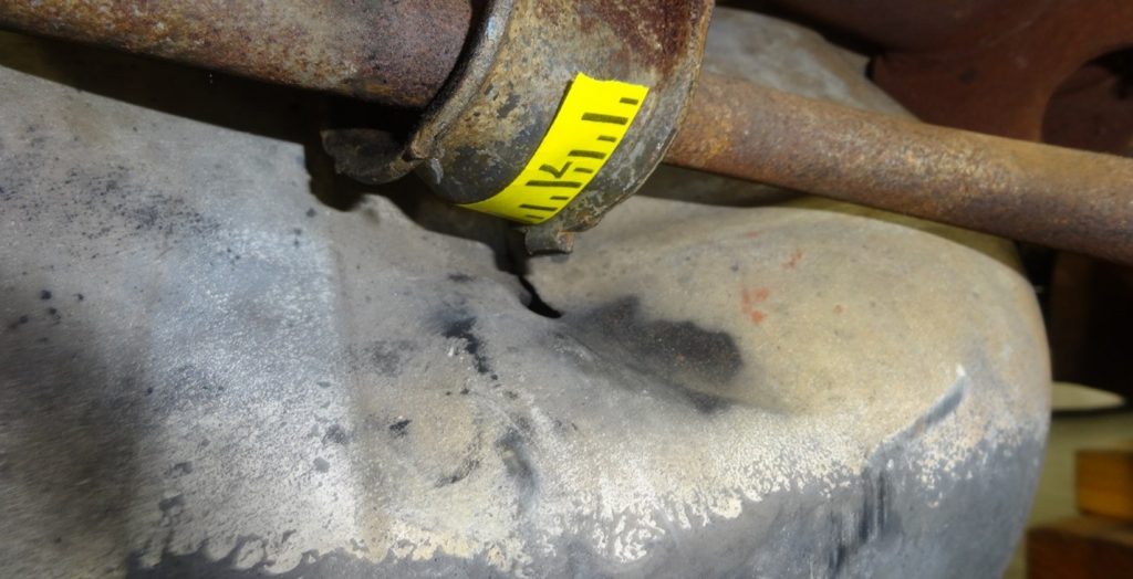 Another exhibit picture displaying evidence of a gas tank defect, contributing to a case study on product liability concerns