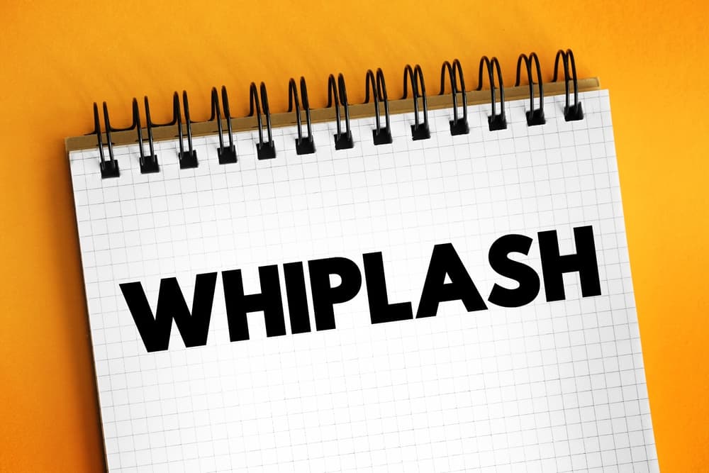 notepad with word 'whiplash'