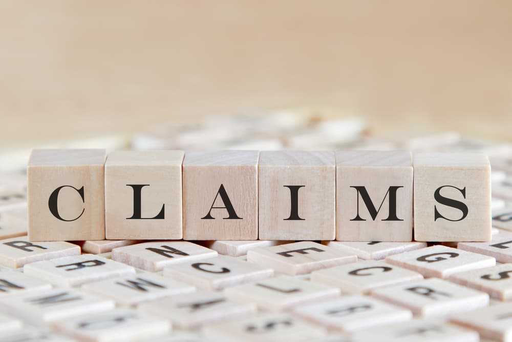 Claims word on wooden cube