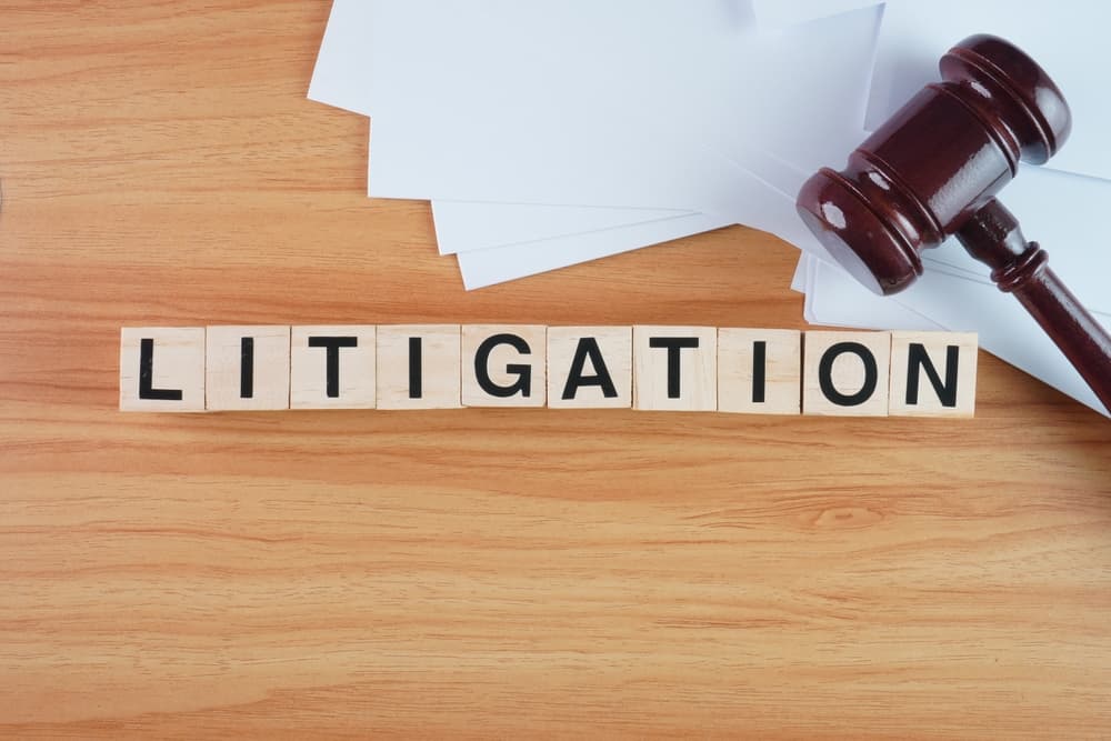 Litigation concept background wooden block letters.