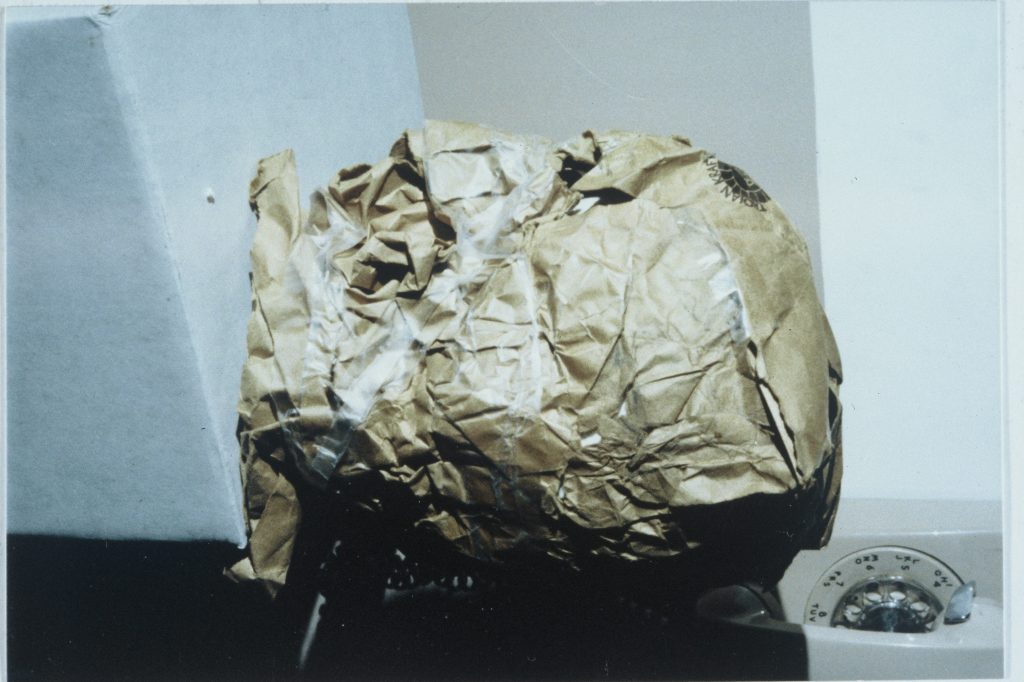 A paper bag labeled with the details of a man's death, part of evidence in a case related to the Rushin incident