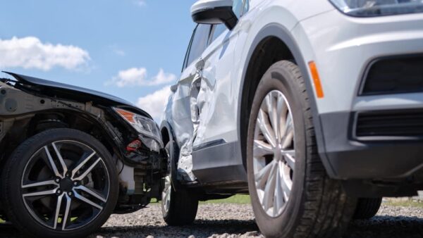 Cars crashed heavily in road accident after collision on city street.