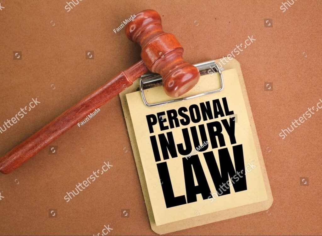 Judge's gavel beside a blackboard reading 'Personal Injury Law,' symbolizing informed legal decisions in injury cases.