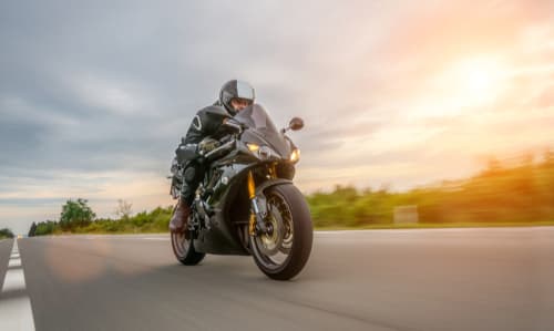 motorcycle riding down highway