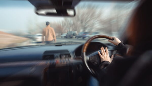 View from inside a car approaching a pedestrian in the roadway in San Jose, illustrating the moment before impact in a government vehicle accident claim