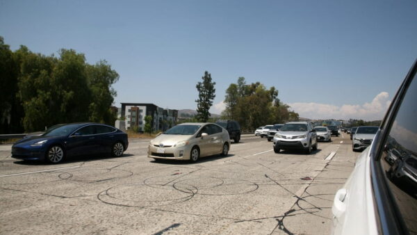 Heavy traffic on a busy San Jose highway during daytime congestion
