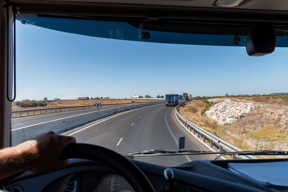 View from inside a commercial truck cab on a highway near San Jose, showing the driving conditions captured by electronic logging device data